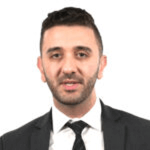 Professional man in suit and tie on white background, business portrait, headshot, corporate profile photo.